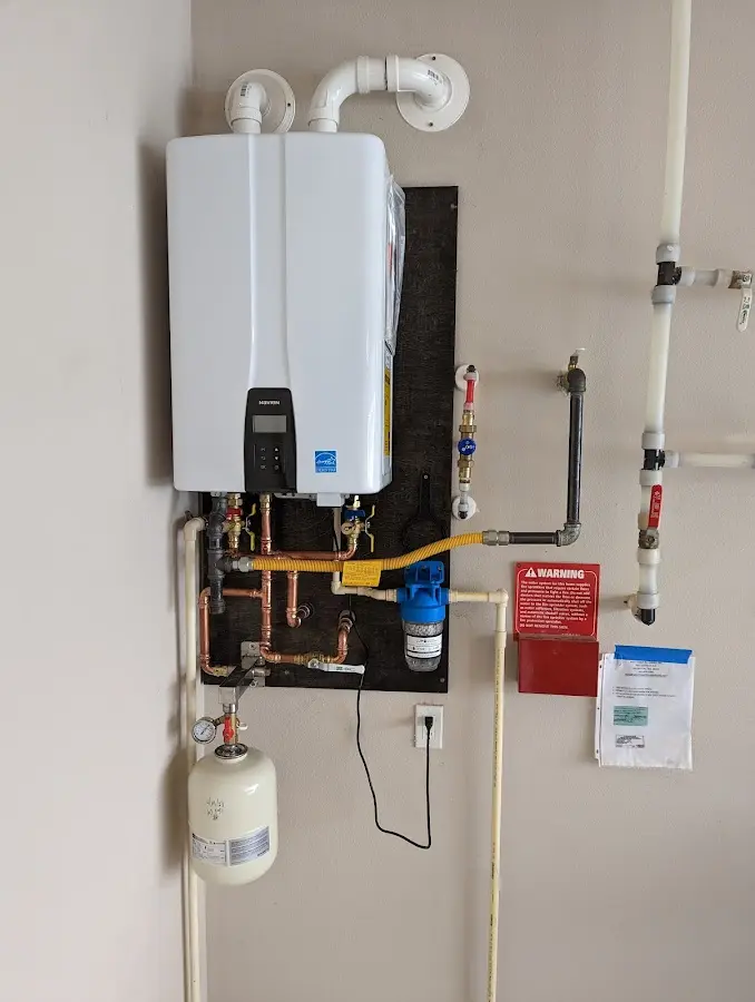 Professional plumber installing copper piping in a Putnam Valley home